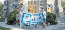  ?? JESSICA NYZNIK EXAMINER ?? From left, Anna Dyer, Barb Vollering, Debbie Youngman and Barb Meade, members of the Women’s Catholic League of St. Joseph’s Parish Hall, showcase this year’s Douro Doings tulip quilt outside St. Joseph’s Church in Douro on Wednesday. Douro Doings, happening Monday, is a fundraiser for the church.