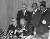  ??  ?? California Gov. Pat Brown, left, and Dr. Martin Luther King Jr, discuss racial issues in Los Angeles on Aug. 19, 1965, following the Watts riots.