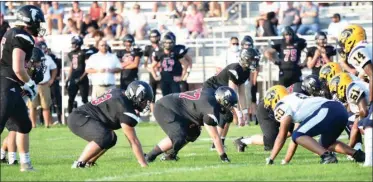  ?? PILOT PHOTO/RON HARAMIA ?? Glenn defensive linemen Kamren Hardesty (63) and Brandon Campion (57) are pictured here lining up against South Bend Riley earlier this season. The Falcon defense will be tested against Bremen this week.