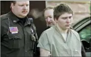  ?? MORRY GASH - THE ASSOCIATED PRESS ?? In this 2006 file photo, Brendan Dassey is escorted out of a Manitowoc County Circuit courtroom in Manitowoc, Wis. Lawyers for Dassey are hoping the Supreme Court will agree to take his case.