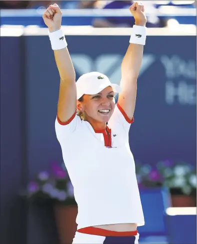  ?? Elsa / Getty Images ?? Simona Halep celebrates match point, giving her the win over Petra Kvitova in the women’s singles final of the New Haven Open in August 2013.
