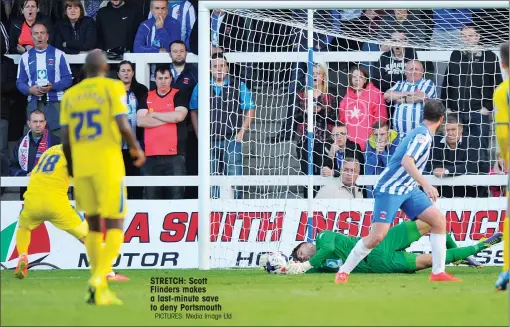  ?? PICTURES: Media Image Ltd ?? STRETCH: Scott Flinders makes a last-minute save to deny Portsmouth