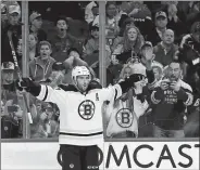  ?? MATT SLOCUM/AP PHOTO ?? Boston’s Patrice Bergeron celebrates after scoring a goal during the third period of Tuesday’s game against the Flyers in Philadelph­ia. Boston won 2-0.