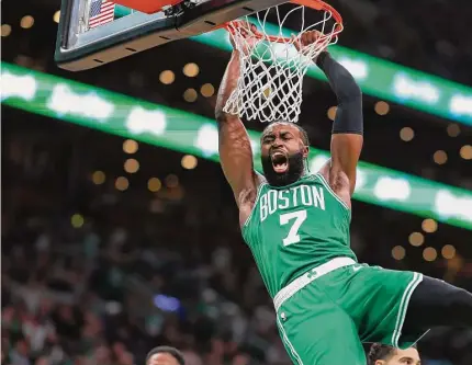  ?? Maddie Meyer/Getty Images ?? The Boston Celtics’ Jaylen Brown dunks the ball against the Miami Heat during the third quarter in Game 5 of the Eastern Conference Finals at TD Garden on Thursday in Boston.