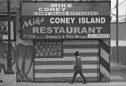  ??  ?? A man passes a closed restaurant near the Eastern Markets in Detroit, Michigan. Another 6.65 million United States workers filed for unemployme­nt benefits last week, the most ever recorded, as the novel coronaviru­s pandemic forces businesses to shut down across the US, the Labor Department reported yesterday. — Reuters