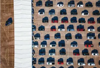  ?? Mark Mulligan / Staff photograph­er ?? People wait in their cars for vaccinatio­ns against COVID-19 at a drive-thru site set up by the city and United Memorial Medical Center at Delmar Stadium in Houston on Jan. 28.