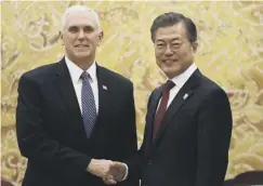  ??  ?? 0 Moon Jae-in, right, with US vice-president Mike Pence