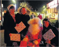  ??  ?? Team effort Organiser Doris Scott with Melanie Carlin, manager of the Spar in Meigle, Santa, and Clare Narey, Spar area manager at the event