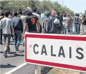  ?? Pictures: PHILIPPE HUGUEN/AFP ?? French port is a magnet for those determined to enter Britain illegally