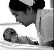  ?? CHEN BIN / XINHUA ?? A newborn baby is taken care of at Gansu Provincial Maternity and Child-care Hospital in Lanzhou in February.