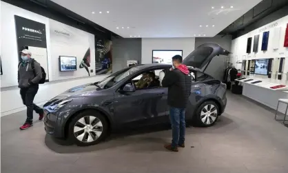  ??  ?? A Tesla Model Y Long Range is displayed at the Tesla Gallery in Troy, Michigan, in February. Sales of the Model Y and demand in China have boosted Tesla’s fortunes. Photograph: Carlos Osorio/AP