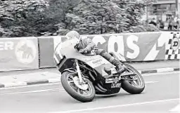  ??  ?? Aboard the big, bad, bruising 996cc Formula 1 Honda four, Rutter howls away from Quarter Bridge in the ’79 TT.