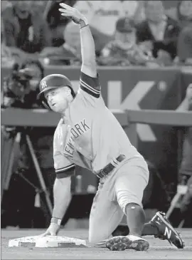  ?? Chris Carlson Associated Press ?? NEW YORK’S Brett Gardner celebrates after his triple against the Angels during the third inning. The Yankees would go on to beat the Angels 7-5.