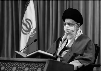  ?? OFFICE OF THE IRANIAN SUPREME LEADER VIA AP ?? In this picture released by an o cial website of the o ce of the Iranian supreme leader, Supreme Leader Ayatollah Ali Khamenei wearing a protective face mask, attends a meeting in Tehran, Iran, on Wednesday.