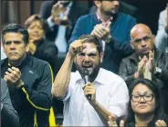  ?? AP File Photo ?? Opposition Venezuelan lawmaker Juan Requesens (center), shown speaking April 5, 2017, at the National Assembly during a session in Caracas, Venezuela, has been accused by President Nicolas Maduro of having a role in the drone explosions that Venezuelan...