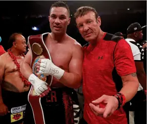  ?? Photo: ACTION IMAGES/ ANDREW COULDRIDGE ?? HAPPY TO TRAVEL: Parker, pictured here with his trainer Kevin Barry, is set for a second consecutiv­e fight in the UK