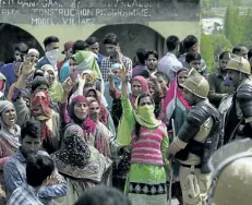  ?? MUKHTAR KHAN/THE ASSOCIATED PRESS ?? Kashmiri villagers demand the bodies of militants killed in a gun battle after storming a military camp in Kashmir, on Thursday. A 70-year-old civilian was killed and seven people were injured during the protest.