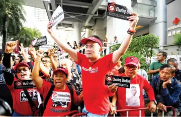  ?? — AFP photo ?? Thai anti-junta protesters shout slogans during a demonstrat­ion in Bangkok disputing results of the country’s first general election since a 2014 coup.