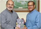  ??  ?? 1usrat presenting the book to Sohail Aman