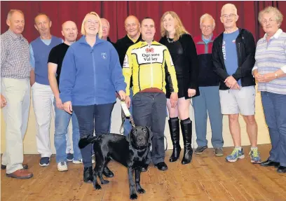  ??  ?? The Ogmore Valley Wheelers with guide dog puppy Wheeler and puppy walker Elaine Francis