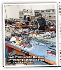  ?? ?? David Phillips amidst the sea of jaw-droppingly expensive cycle parts and accessorie­s