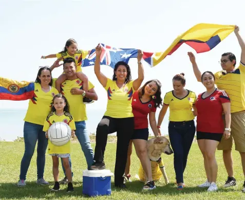  ?? Picture: KATRINA BRIDGEFORD. ?? Latin Americans are at home in Darwin including, Katheryn Meneses, Diego Zambrano, Mia Zambrano (on shoulders), Abby Zambrano (with ball), Giovanna Webb, Pamela Calderon, Pilar Preciado, Natalia Pena, Oscar Mora and Ted the dog