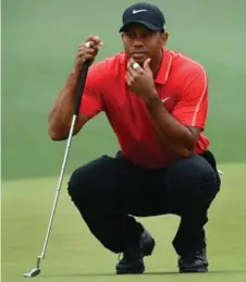  ?? JEFF SINER/CHARLOTTE OBSERVER/TNS ?? Nike, which grew its golf line thanks to Tiger Woods, is taking notice of Under Armour’s emergence as a key player in the golf-apparel market.