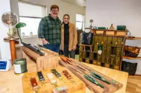  ?? Lucy Schaly/Post-Gazette ?? Jocelyn Avila and Rob Hackett in their studio, Clark Morelia in Swissvale on Jan. 8. They said they fell in love with leather work in 2019, when they began making small items at home for friends and family.