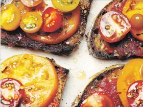  ?? KARSTEN MORAN NYT ?? As high summer hits, and with it, an abundance of fresh, vibrant tomatoes, some version of tomatoes on toast is a very good idea.