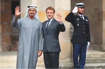  ?? WAM ?? Shaikh Mohammad Bin Zayed Al Nahyan is received by Emmanuel Macron in Paris.