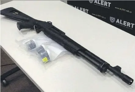  ??  ?? A shotgun with its serial number defaced, 500 fentanyl pills, 20 grams of suspected fentanyl powder and 102 grams of a unique fentanyl-heroin mix were seized April 7 in a joint Alberta-Saskatchew­an police task-force operation.