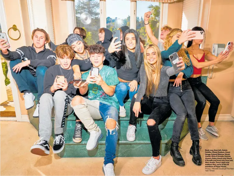  ?? Photos / Michelle Groskopf/The New York Times) ?? Back row, from left, Calvin Goldby, Chase Hudson, Avani Gregg, Ryland Storms, Wyatt Xavier, Dixie D'Amelio, Patrick Huston, Daisy Keech and Charli D'Amelio and front row, from left, Nick Austin, Tony Lopez and Addison Rae, some of the 19 members of Hype House.