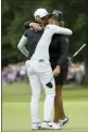 ?? TIM IRELAND — THE ASSOCIATED PRESS ?? Lizette Salas of the United States, right, embraces, Korea’s Ko Jin-young on the 18th green after finishing the final round of the Women’s British Open golf championsh­ip at Woburn Gold Club near near Milton Keynes, England, Sunday.
