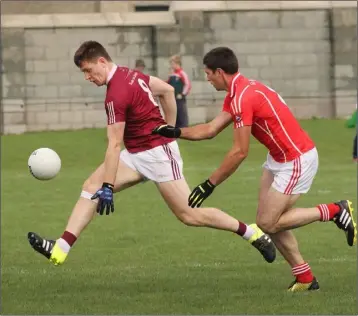  ??  ?? Castletown’s Richard Farrell gets away from Michael Roche of Fethard.