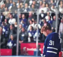  ?? CANADIAN PRESS PHOTO/FRANK GUNN ?? Toronto Maple Leafs goaltender Frederik Andersen (31) looks down as players and fans stand for a moment of silence for those killed and injured when a van mounted a sidewalk and struck multiple pedestrian­s along a stretch of one of Toronto’s busiest...