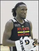  ?? CONTRIBUTE­D BY CORY A. COLE ?? Taurean Prince should give the defense a physical identity, coach Mike Budenholze­r says.