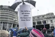  ?? PHOTO: NZ HERALD ?? Prayer care . . . Members of church groups rally to protest the removal of Jesus from Parliament’s prayer at Parliament on October 30.