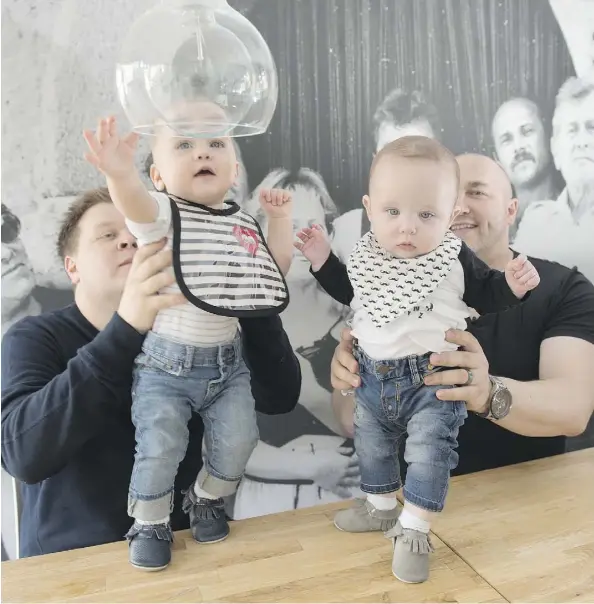  ?? SHAUGHN BUTTS ?? Dani Braun and his son, Max, six months, and Daniel Costa and son, Gennaro, nine months, enjoy some time together. The two new dads who are chefs and restaurant owners, plan to pass along the tradition of celebratin­g food and family.