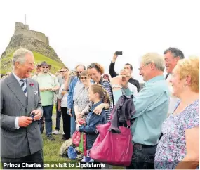  ??  ?? Prince Charles on a visit to Lindisfarn­e