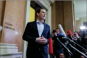  ?? (AP/Heinz-Peter Bader) ?? Former Austrian Chancellor Sebastian Kurz talks to reporters after the verdict of his trial in Vienna on Friday.