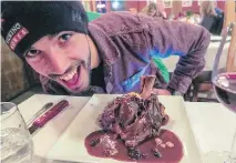  ??  ?? Emile Lavoie prepares to dive into some bison tenderloin at Corks Restaurant at Copper Horse Lodge, a boutique hotel at Kicking Horse Mountain Resort.