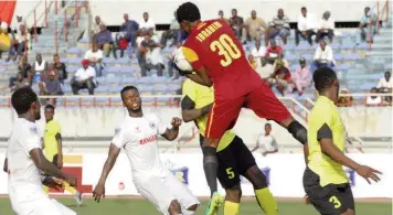  ??  ?? Wikki Tourists’ goalkeeper, Pius Ibrahim goes for the ball during a recent NPFL game against Enugu Rangers.