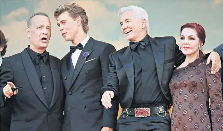  ?? ?? Baz Luhrmann, the director, wears an Elvis-inspired belt on the red carpet at Cannes. Joining him on the red carpet were Tom Hanks and Austin Butler, the film’s stars, and Priscilla Presley, the rock singer’s former wife