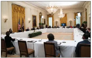  ?? (AP/Evan Vucci) ?? President Joe Biden addresses his Cabinet members Thursday in the East Room of the White House. Biden said the diverse group “looks like America” and added, “that’s what we promised we were going to do, and we’ve done it.”