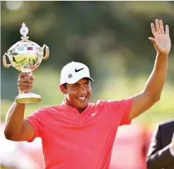  ?? — AFP ?? OAKVILLE: Jhonattan Vegas of Venezuela poses with the trophy following the final round of the RBC Canadian Open at Glen Abbey Golf Club on July 30, in Oakville, Canada.