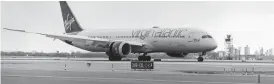  ?? ?? Virgin Atlantic Boeing 787 arrives at Kennedy airport in New York in November 2023 to complete the first transatlan­tic flight using 100% sustainabl­e aviation fuel. The flight had departed from London.