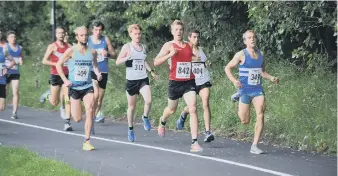  ??  ?? Action from the Men’s race in the 5k road races.