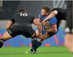  ??  ?? Sam Cane, right, and Ofa Tu’ungafasi try to tackle France wing Remy Grosso in the first test last weekend.