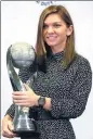  ?? JEREMY LEE / REUTERS ?? Simona Halep poses with her WTA year-end world No 1 trophy on Sunday.