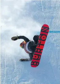  ?? PHOTOS BY JEAN LEVAC OF POSTMEDIA NEWS AND JONATHAN HAYWARD OF THE CANADIAN PRESS ?? Laurie Blouin of Canada reacts after winning silver in women’s snowboard slopestyle. Many of her fellow competitor­s fell during windy conditions.